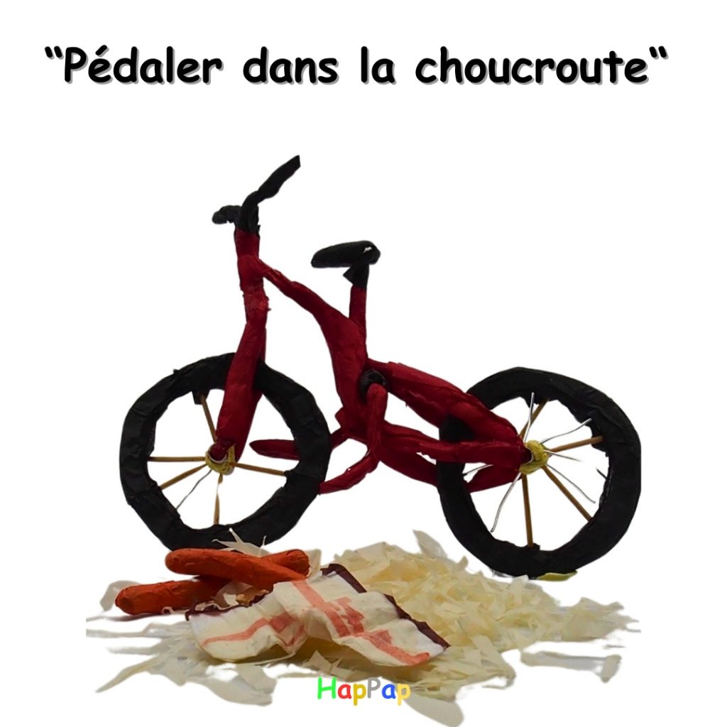 pédaler dans la choucroute illustration en papier de soie petit chef vélo expression française