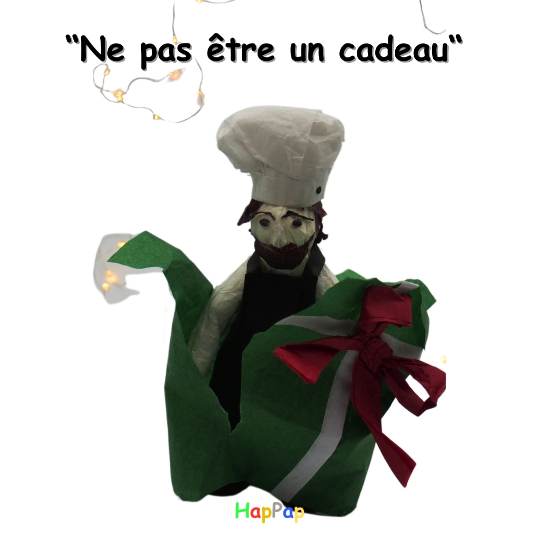Personnage Petit Chef en papier de soie tenant un cadeau, illustration de l’expression française « ne pas être un cadeau »